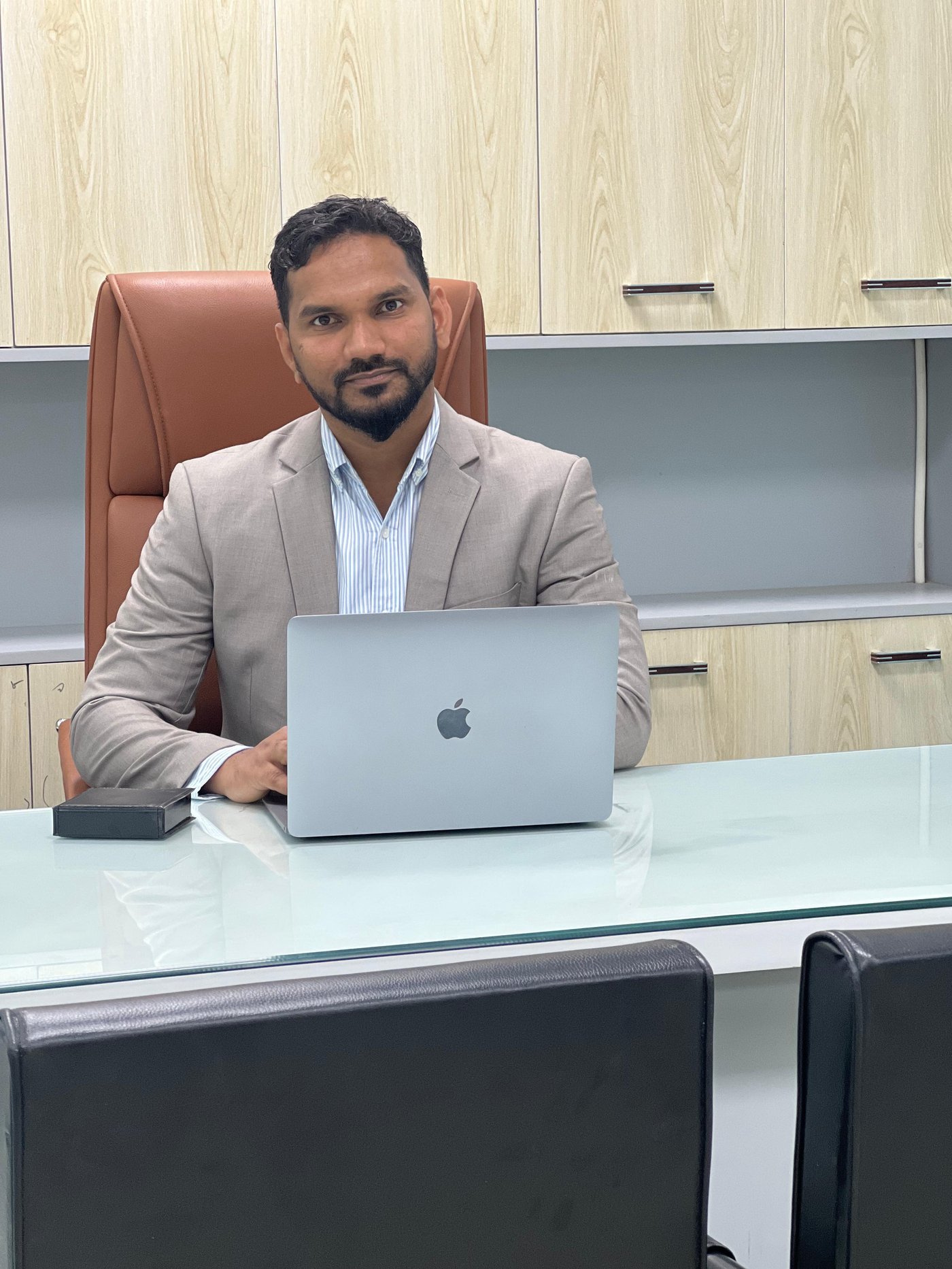 Asadulla Rahman working at his desk